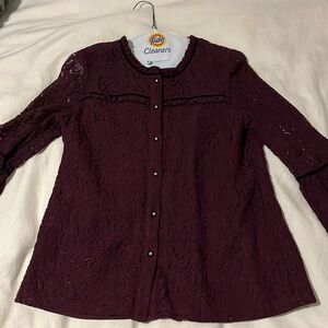 Karl Lagerfeld lace top with lined trunk and ruffle around collar.